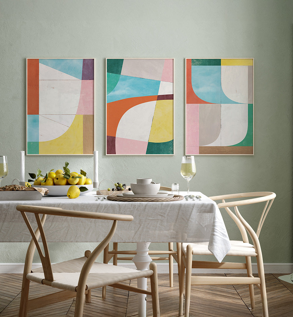 Dining room with abstract art on the wall and a set table.
