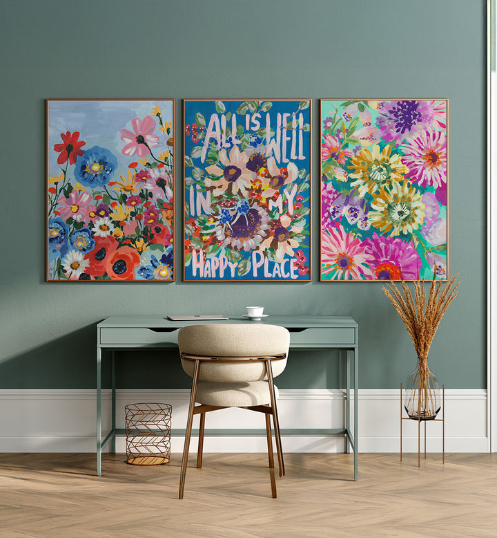 Colorful floral and text wall art above a desk with a chair.