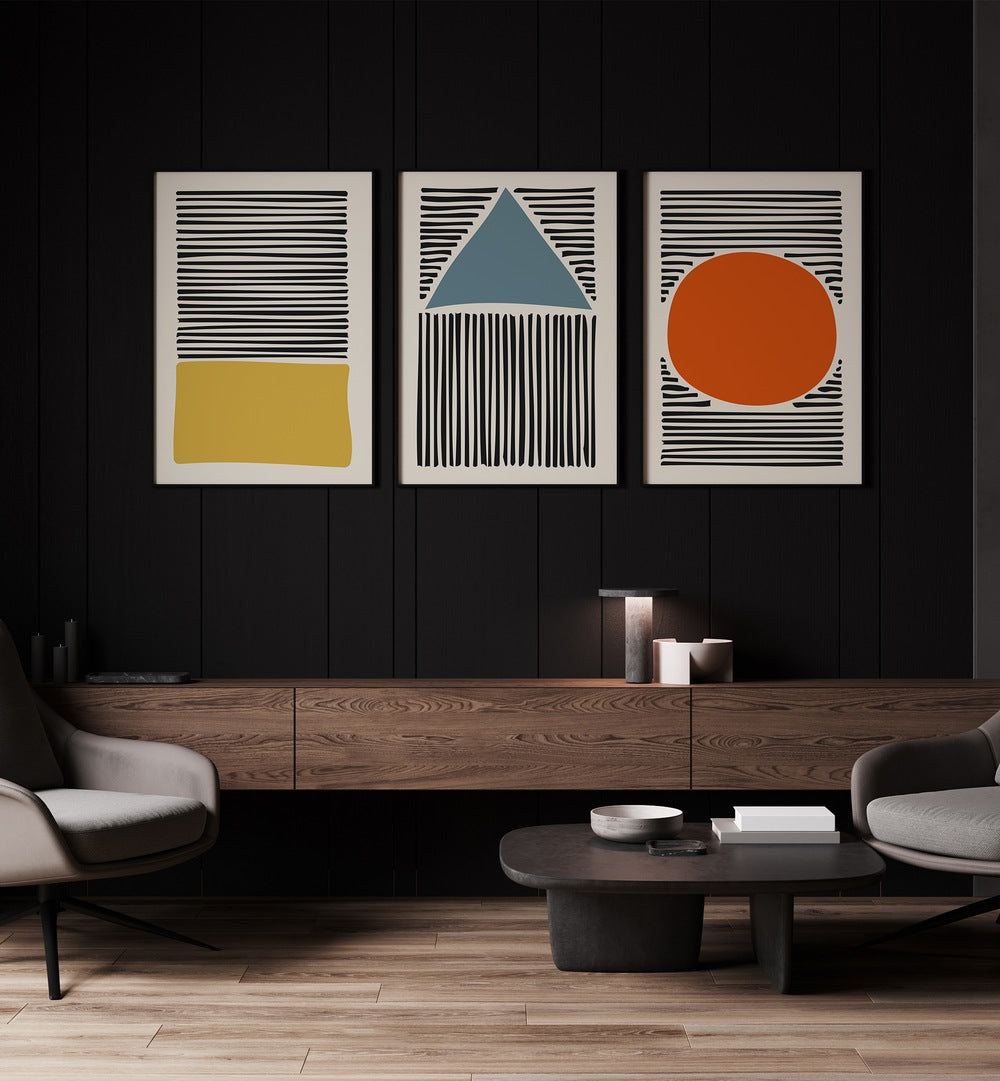 Geo Lines Set Set Of 3 Paintings in Black Plain Frame placed on a wall behind a table for work place