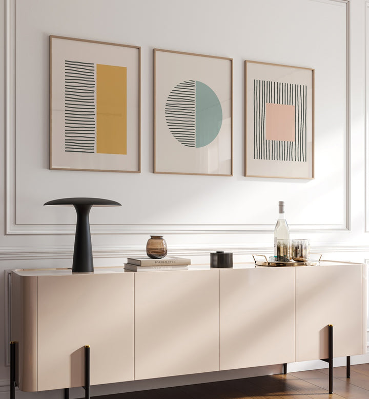 Geometric Duality Set Set Of 3 Paintings in Oak Wood Plain Frame placed on a wall behind a console table