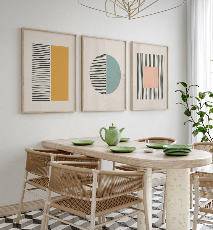 Geometric Duality Set Set Of 3 Paintings in Oak Wood Plain Frame placed on a wall behind a dining table and beside a window for dining area