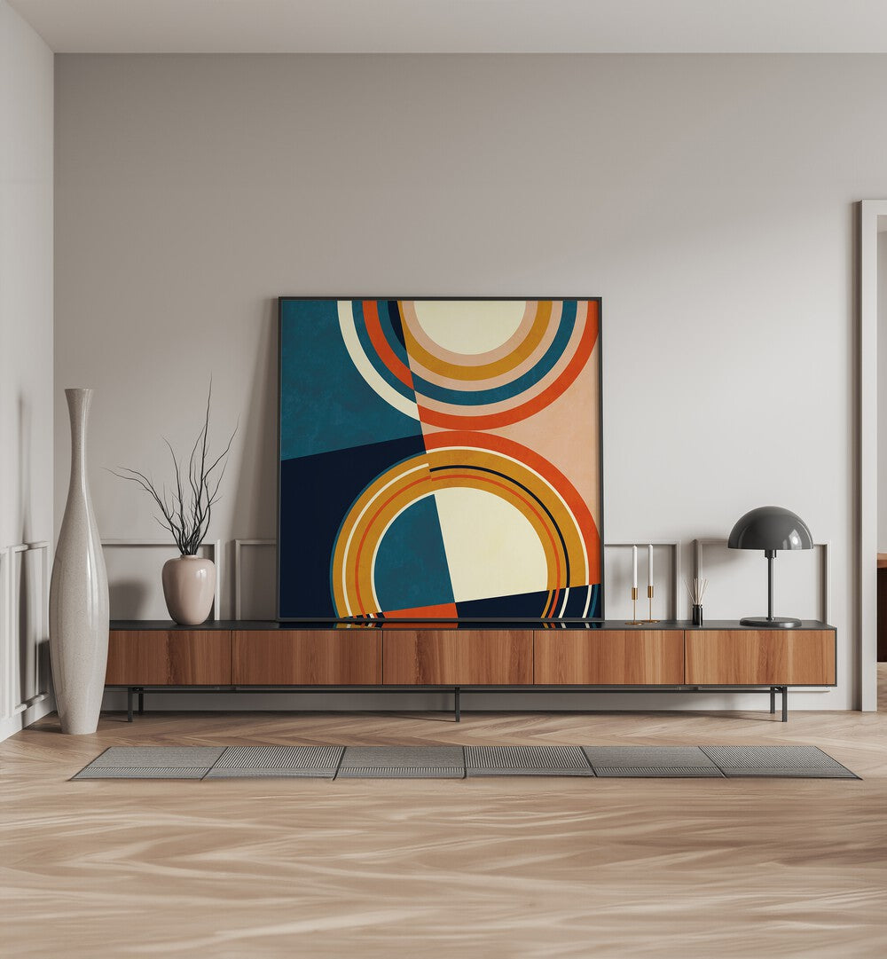 Geometry New I By Ana Rut Bre Abstract Art Abstract Paintings in Black Plain Frame placed on a Console Table near a Cream Colored Wall in the Drawing Room