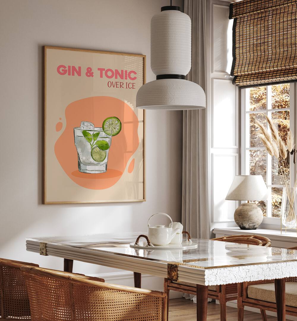 Gin and Tonic Cafe Art Prints Cafe Posters in Oak Wood Plain Frame placed on a wall in a dining room area beside a window and behind a dining table