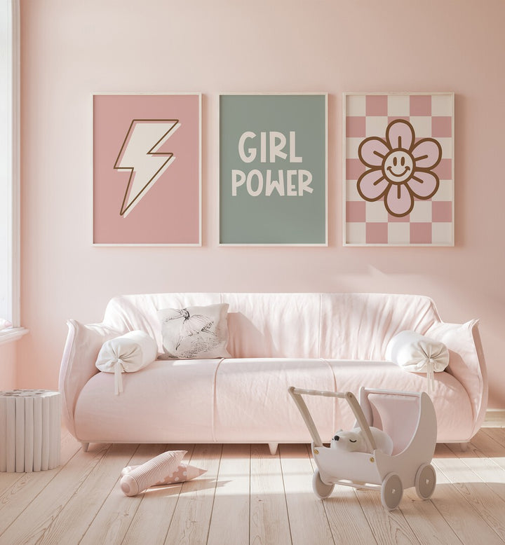 Girl Power Set Of 3 Paintings in White Plain Frame placed on a wall behind a sofa in a kids room