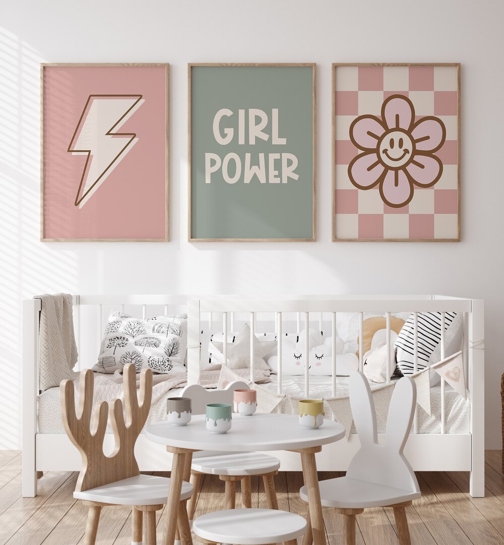 Girl Power Set Of 3 Paintings in Oak Wood Plain Frame placed on a white wall behind a kids bed for kids room