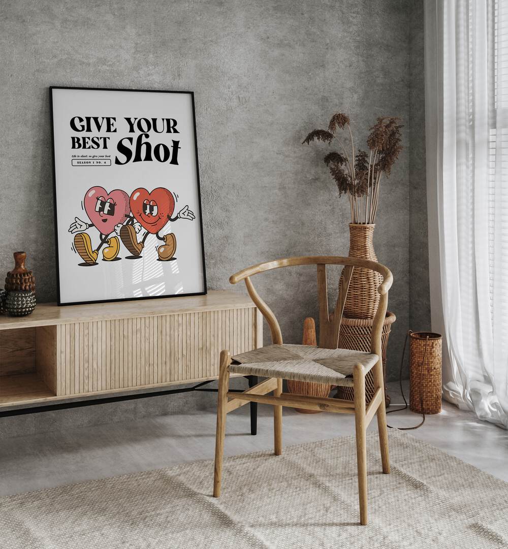 Give Your Best Shot Quotes and Typography Posters in Black Plain Frame placed on a wall behind a console table