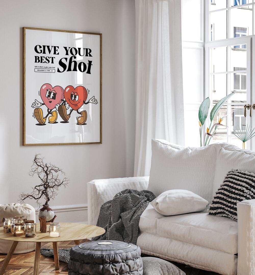 Give Your Best Shot Quotes and Typography Posters in Oak Wood Plain Frame placed on a wall in a living room beside a sofa and window