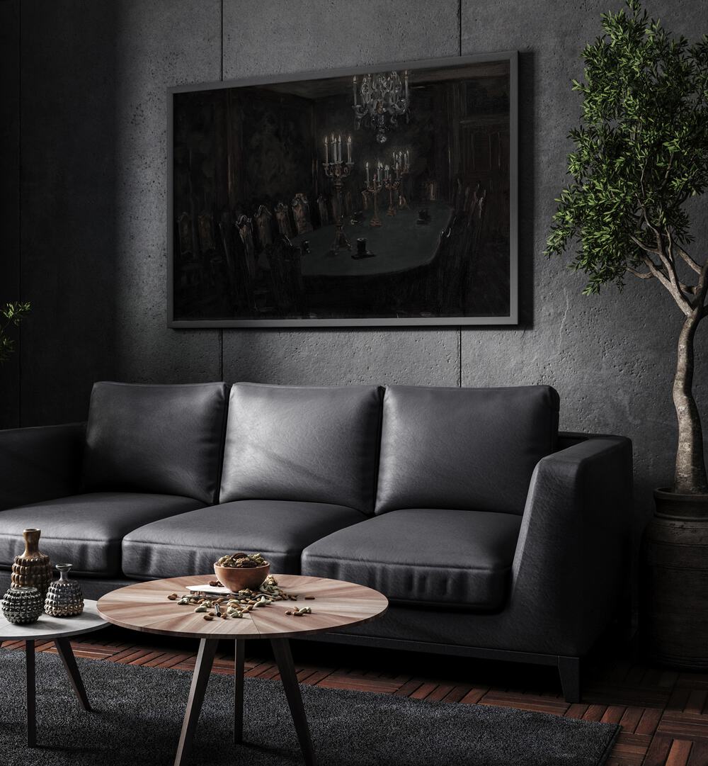 Gloomed Dining Hal Gothic Wall Art Prints in Black Plain Frame hanging on a wall above black leather couch beside a plant.