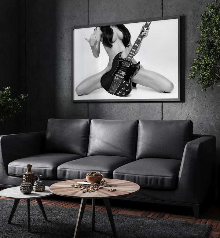 Go Rock Yourself by David Drake Fine Art Photography Fashion Photography in Black Plain Frame placed on a living room wall behind a sofa