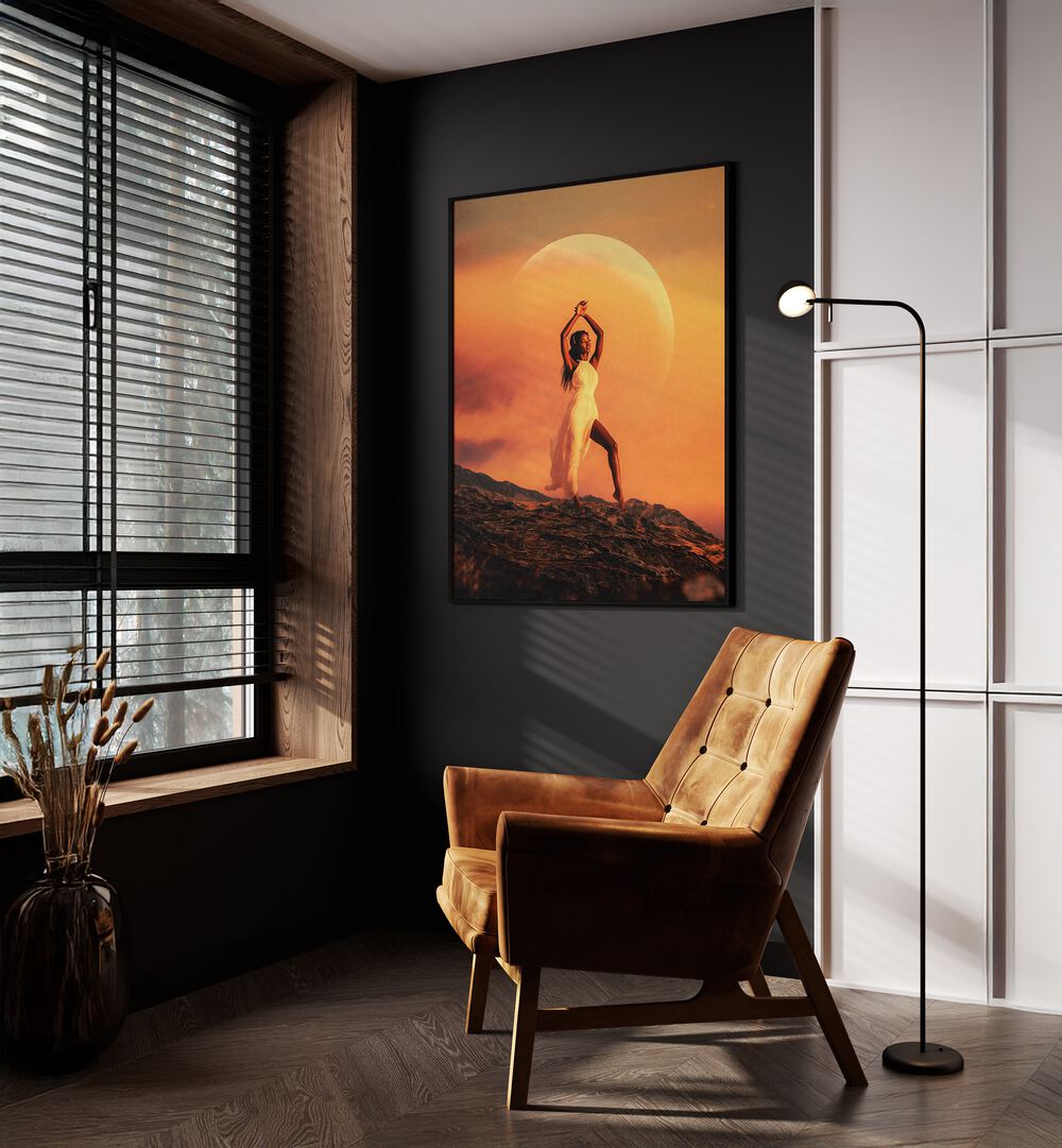 Goddess Surreal Paintings Surreal Art Prints in Black Plain Frame placed on a Dark Grey Colored Wall near a Brown Sofa Chair in the Drawing Room