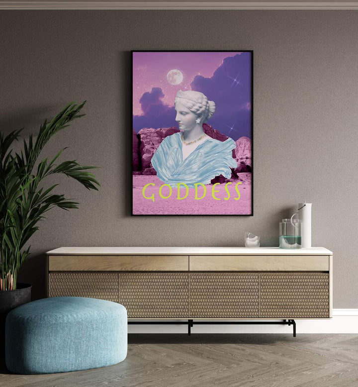 Goddess by Grace Digital Art Co Altered Art Prints in Black Plain Frame placed on a wall behind a console table and beside a plant