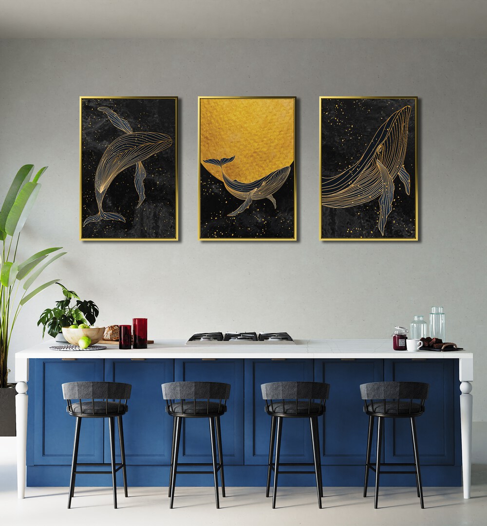 Golden Marina Set Of 3 Paintings in Gold  Plain Frame placed on a wall behind a kitchen counter