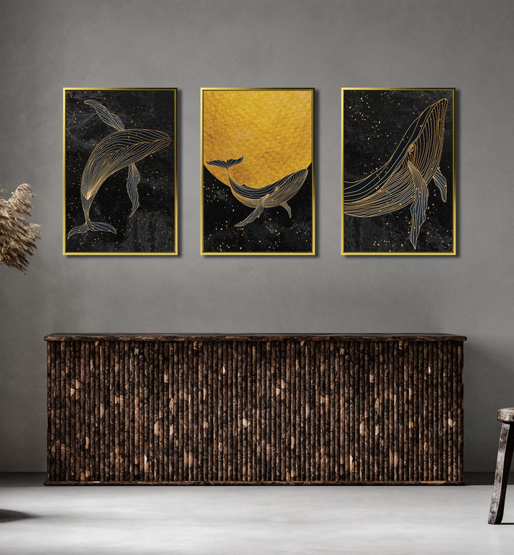 Golden Marina Set Of 3 Paintings in Gold Plain Frame placed on a wall behind a table