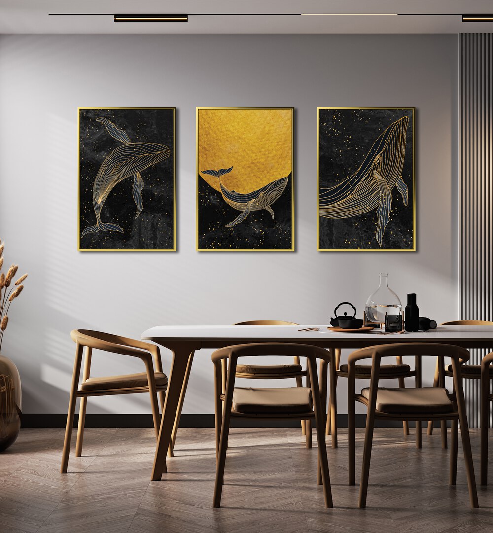 Golden Marina Set Of 3 Paintings in Gold Plain Frame placed on a wall behind a dining table for dining area