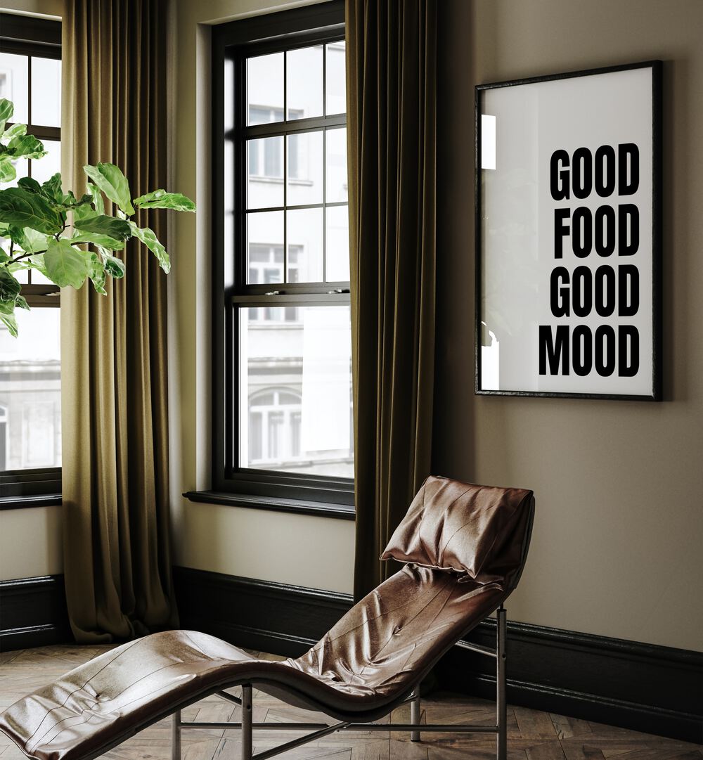 Good Food Good Mood by Athene Fritsch Quotes and Typography Posters in Black Plain Frame placed on a living room wall behind a chair and beside a window