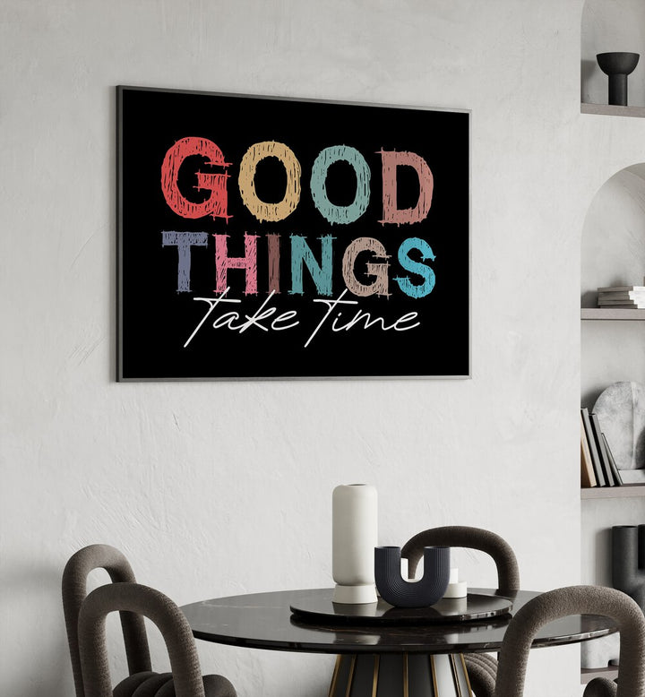 Good Things Quotes and Typography Posters in Black Plain Frame placed on a wall behind a dining table for dining area