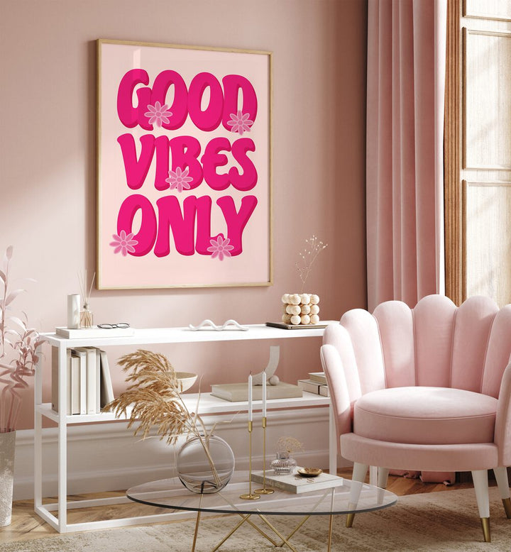 Good Vibes Print Quotes and Typography Posters in Oak Wood Plain Frame placed on a wall behind a table