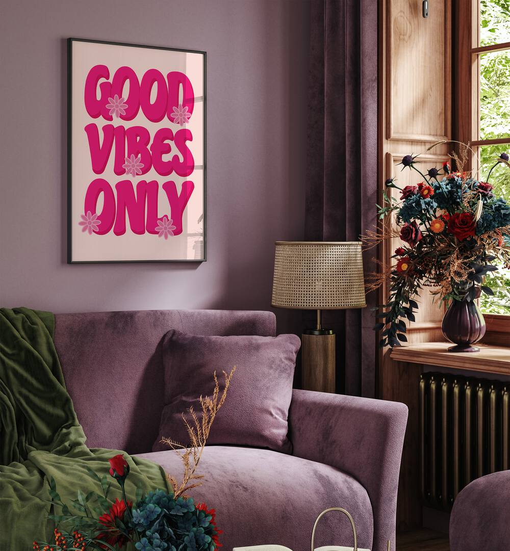 Good Vibes Print Quotes and Typography Posters in Black Plain Frame placed on a wall behind a sofa