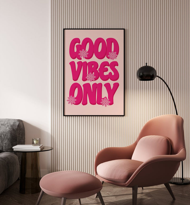 Good Vibes Print Quotes and Typography Posters in Black Plain Frame placed on a wall beside a chair