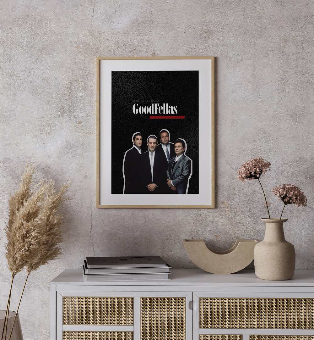 Goodfellas By Grishma Korjani Movie Posters in Oak Wood Frame With Mount placed on a Beige Colored Wall above a Console Table 