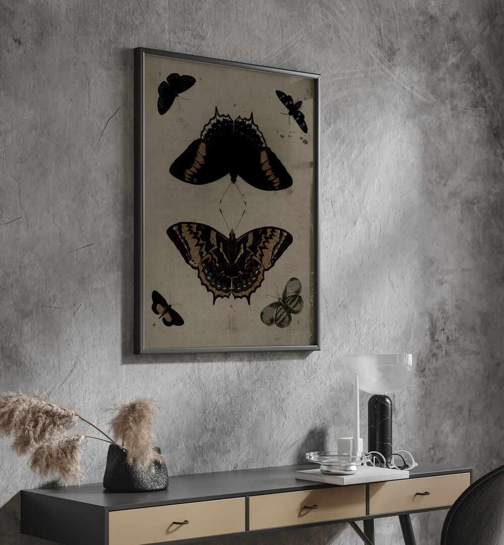 Gothic Flutter Wings Of Darkness And Intrigue Gothic Art Prints in Black Plain Frame hanging on wall above console table.