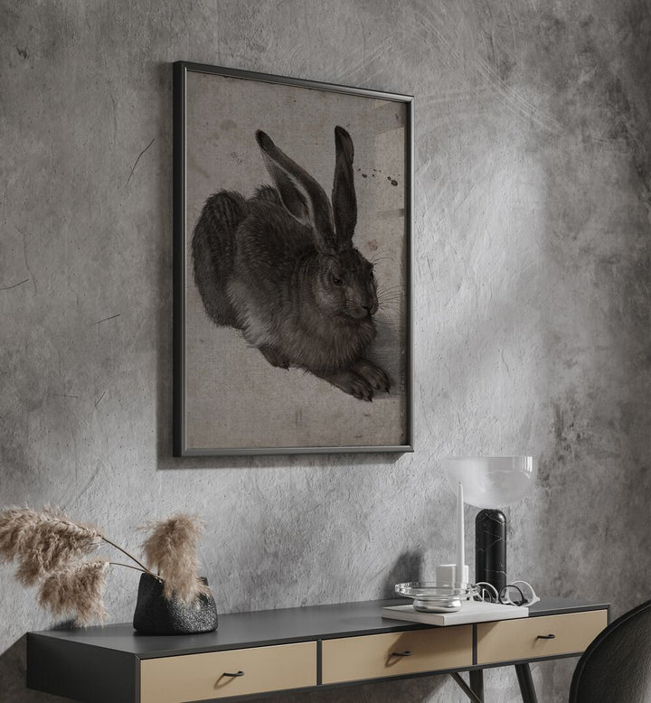 Gothic Hare Shadows In The Warren Gothic Art Prints in Black Plain Frame hanging on wall above console table.