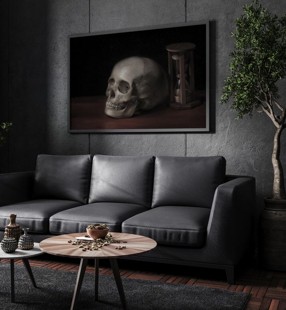 Gothic Remains ii Gothic Wall Art Prints in Black Plain Frame hanging on a wall above black leather couch beside a plant.