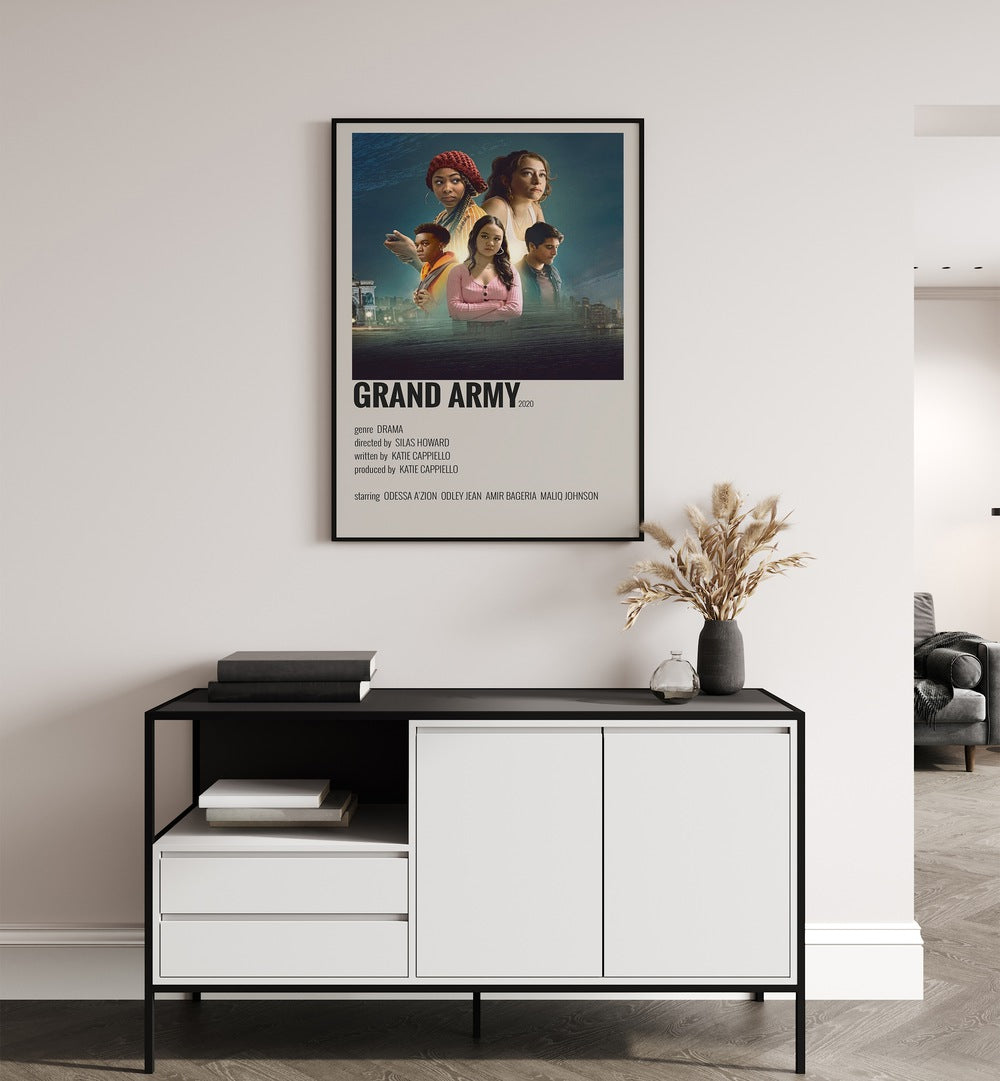 Grand Army Movie Posters in Black Plain Frame placed on a white wall behind a black and white table