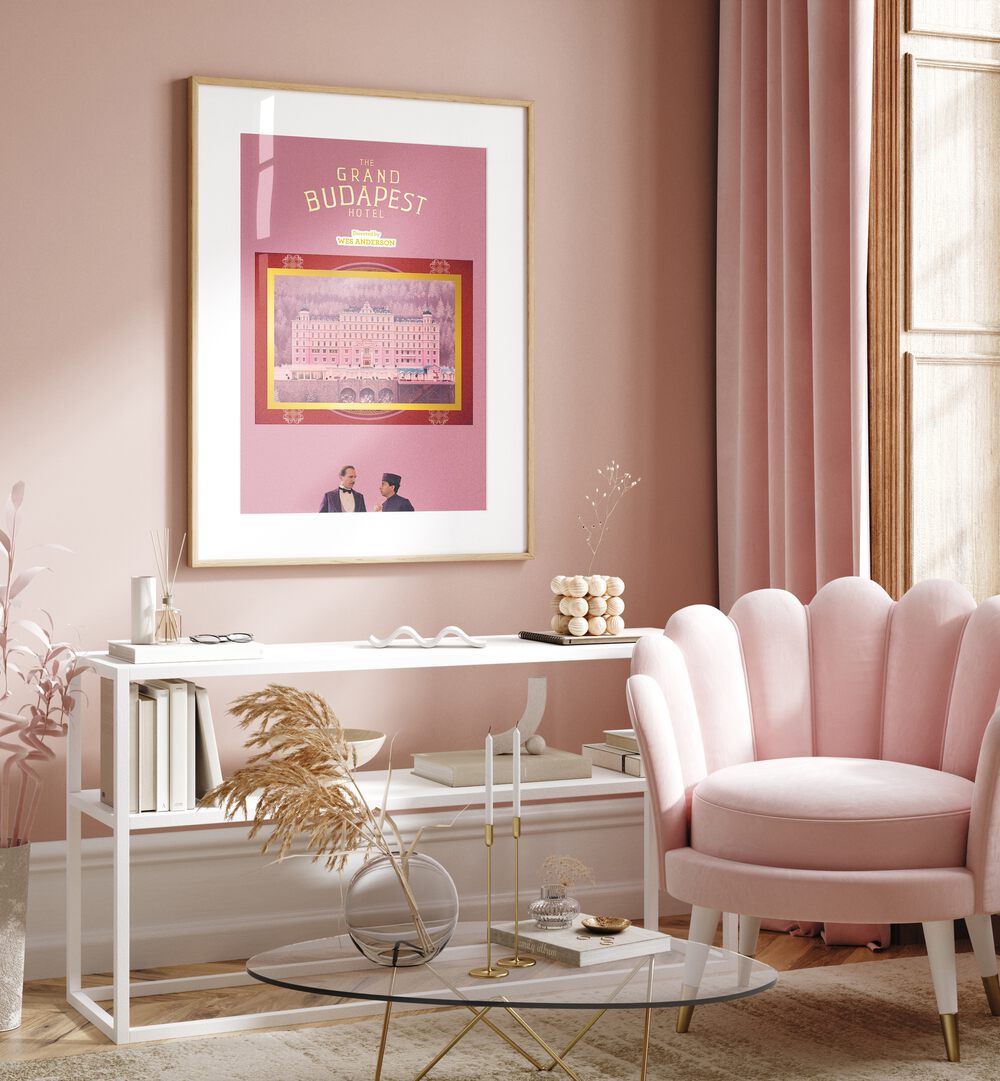 Grand Budapest Hotel By Grishma Korjani Movie Posters in Oak Wood Frame With Mount placed on a Pink Colored Wall in the Drawing Room