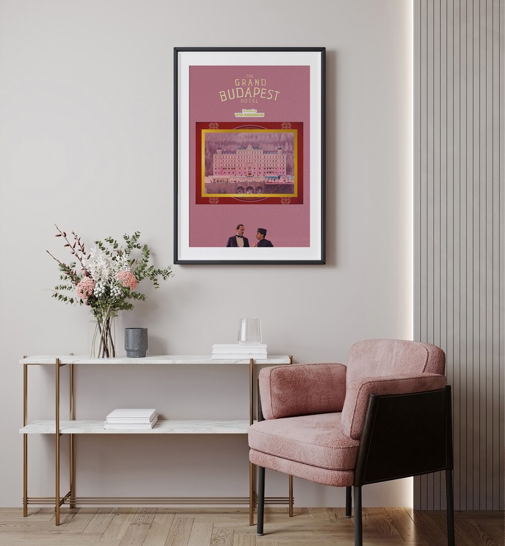 Grand Budapest Hotel By Grishma Korjani Movie Posters in Black Frame With Mount placed on a Cream Colored Wall above a Console Table in the Drawing Room