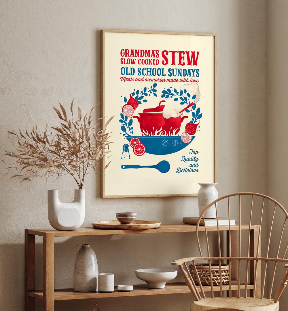 Grandmas Stew by Studio Mandariini Kitchen Posters Kitchen Art Prints in Oak Wood Plain Frame placed on a wall behind a table