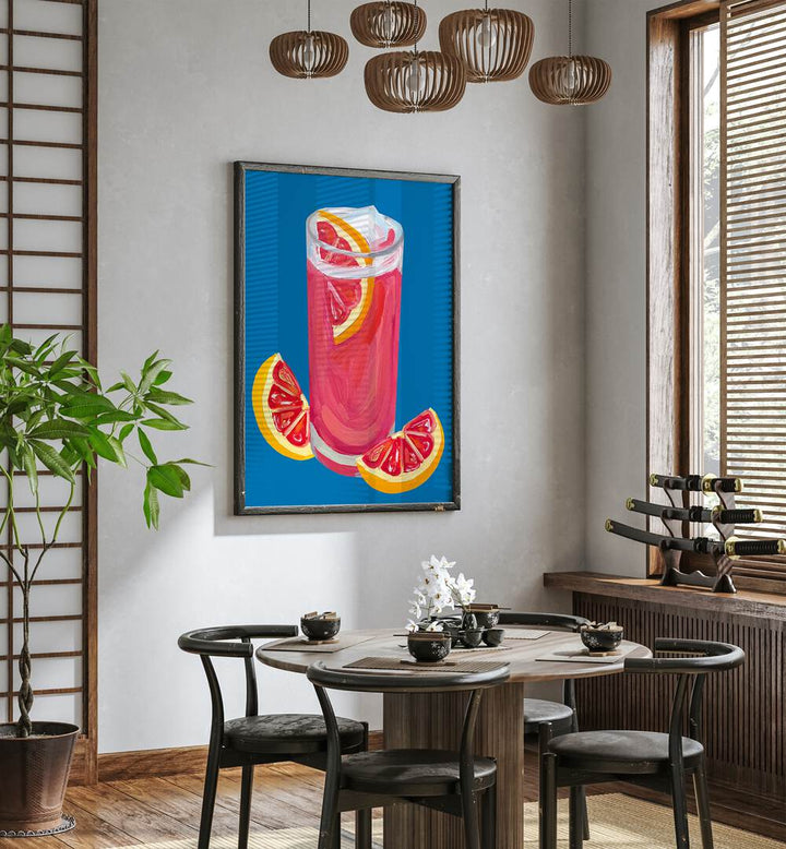 Grapefruit Paloma Blue by Alice Straker Bar Posters Bar Art Prints in Black Plain Frame placed on a wall in a dining room area beside a window and behind a dining table