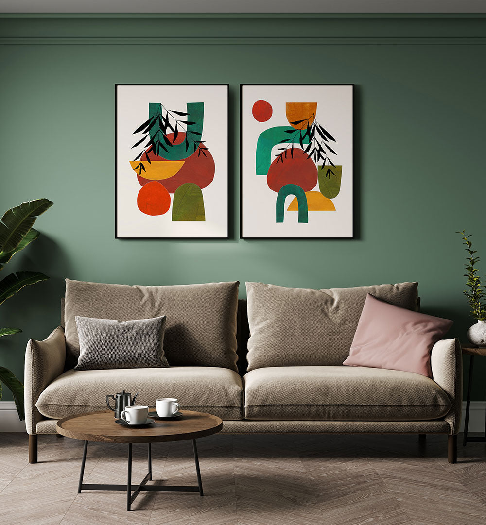 Modern living room with a gray sofa, round wooden coffee table, and abstract art on a green wall.