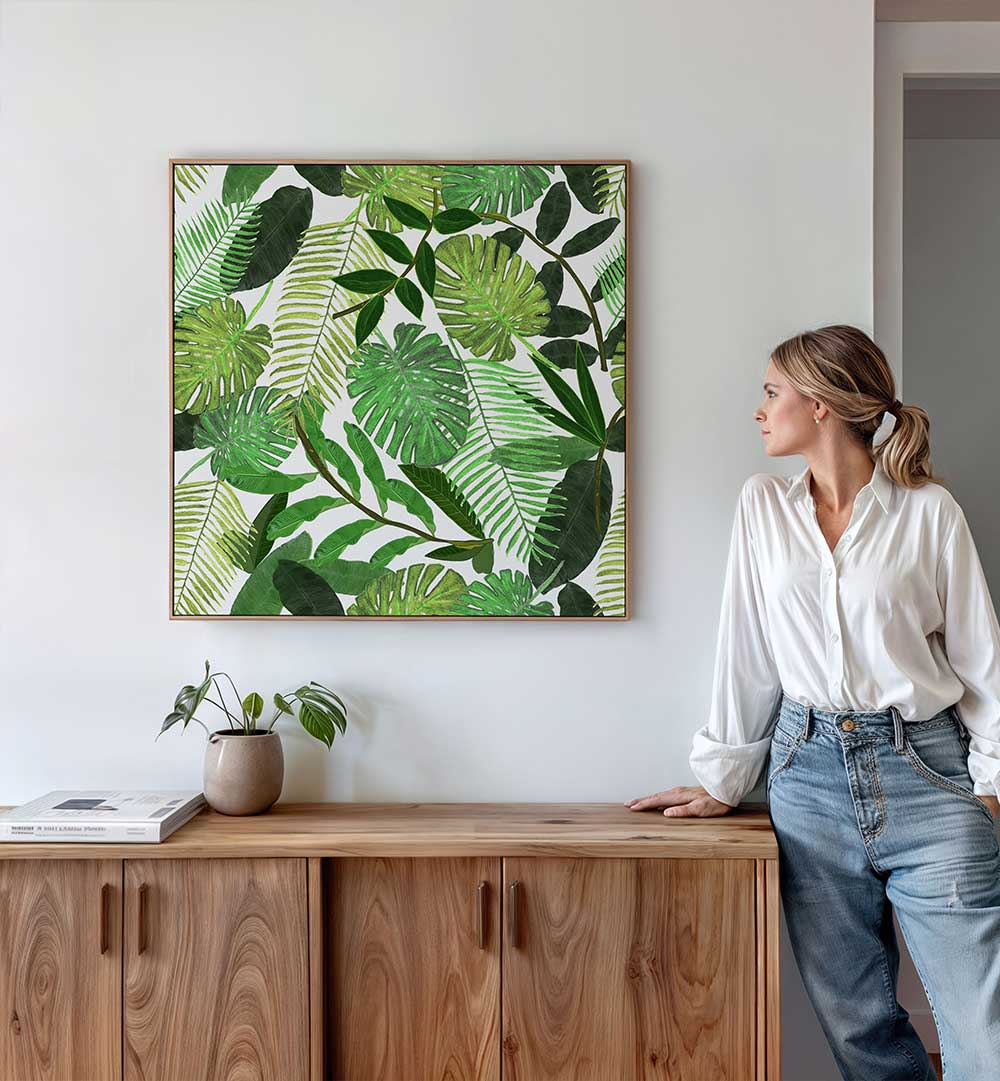 GREEN TROPICAL WATERCOLOR LEAVES , FLORAL FLOWER PAINTINGS framed botanical watercolor print of mixed tropical leaves on a living room wall