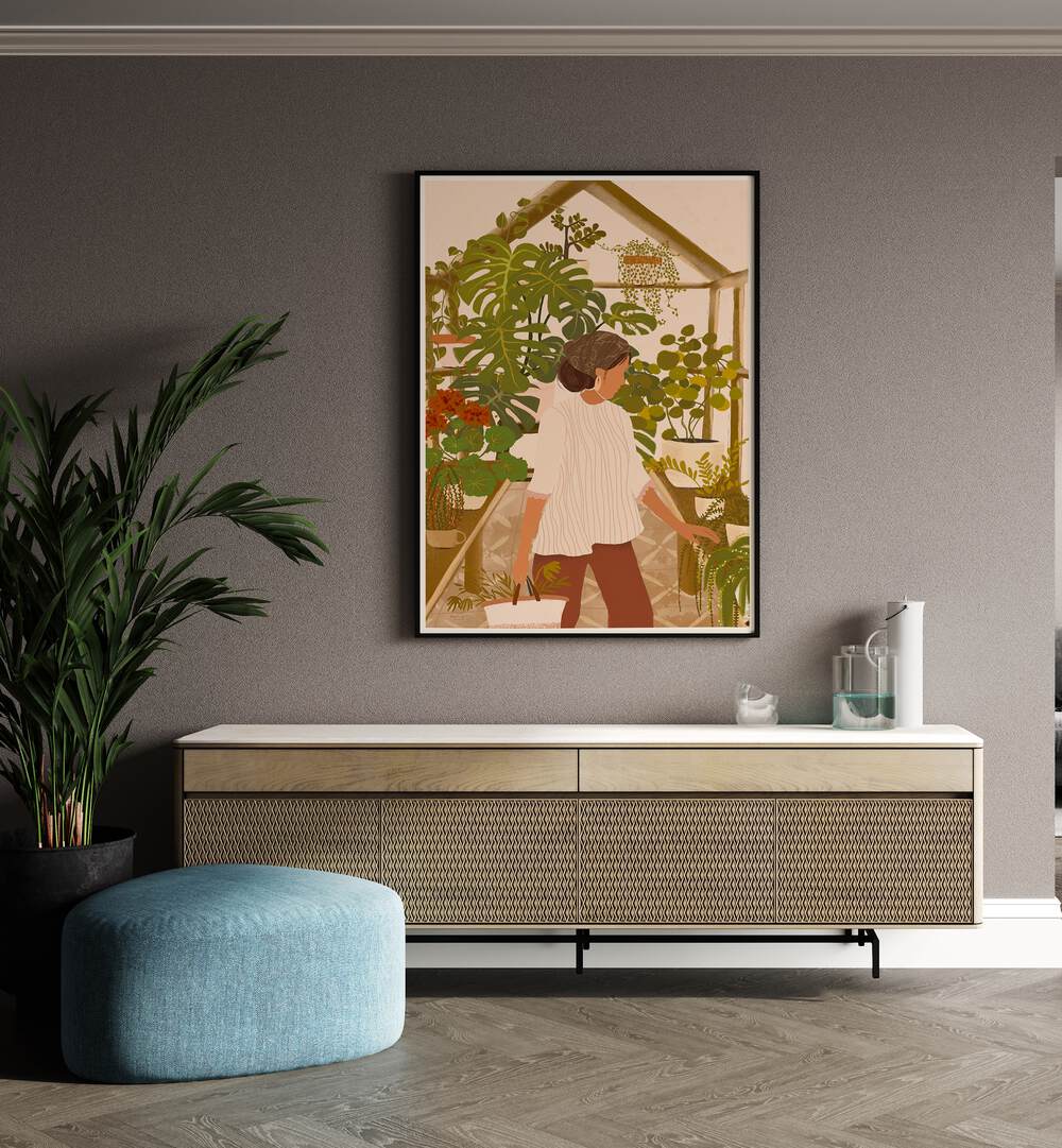 Greenhouse By Andi Bell Botanical Art Prints in Black Plain Frame on a wall placed above a console table