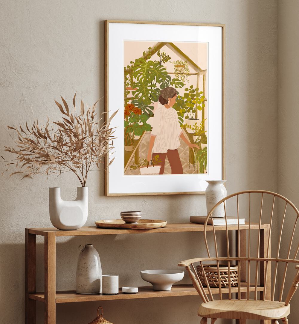 Greenhouse By Andi Bell Botanical Art Prints in Oak Wood Frame With Mount on a wall placed above a table