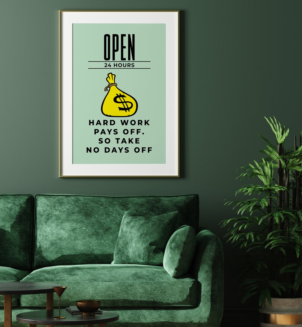 Hark Work Pays Off Money Art Artwork in oak wood frame with mount hanging on wall above green sofa in living space