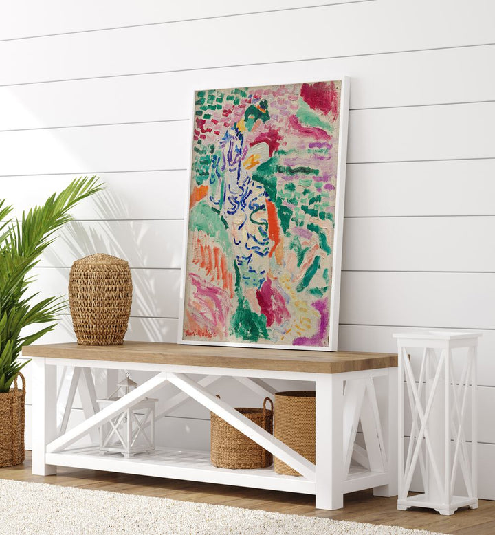 Henri Matisse's 'la Japonaise Vintage Art Painting Artwork in plain white frame on a table beside a plant