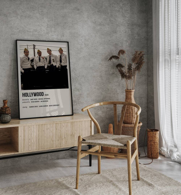 HOLLYWOOD 2020 MOVIE POSTERS in Black Plain Frame placed on a table beside chair