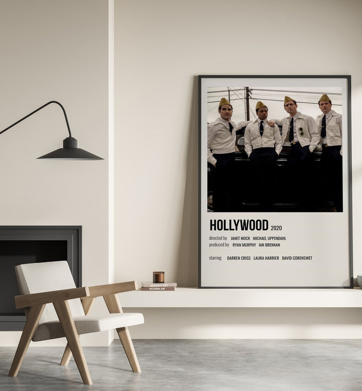 HOLLYWOOD 2020 MOVIE POSTERS in Black Plain Frame placed on wall beside chair and lamp