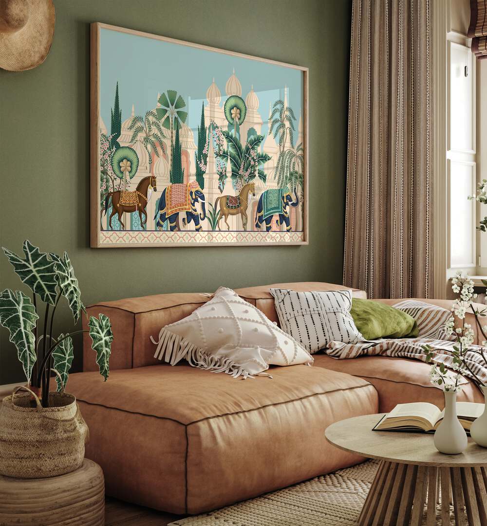 Horse And Elephant Royal Procession Indian Art Painting Artwork in Oak Wood Plain Frame placed on a Green Colored Wall Behind a Brown Leather Sofa in the Living Room