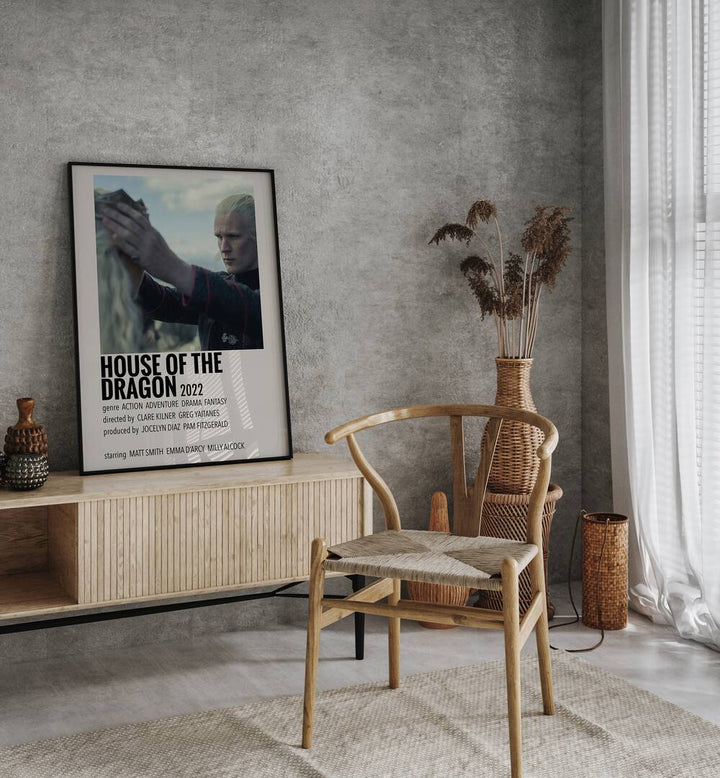 HOUSE OF THE DRAGON 2022 II MOVIE POSTERS in Black Plain Frame placed on a table beside chair