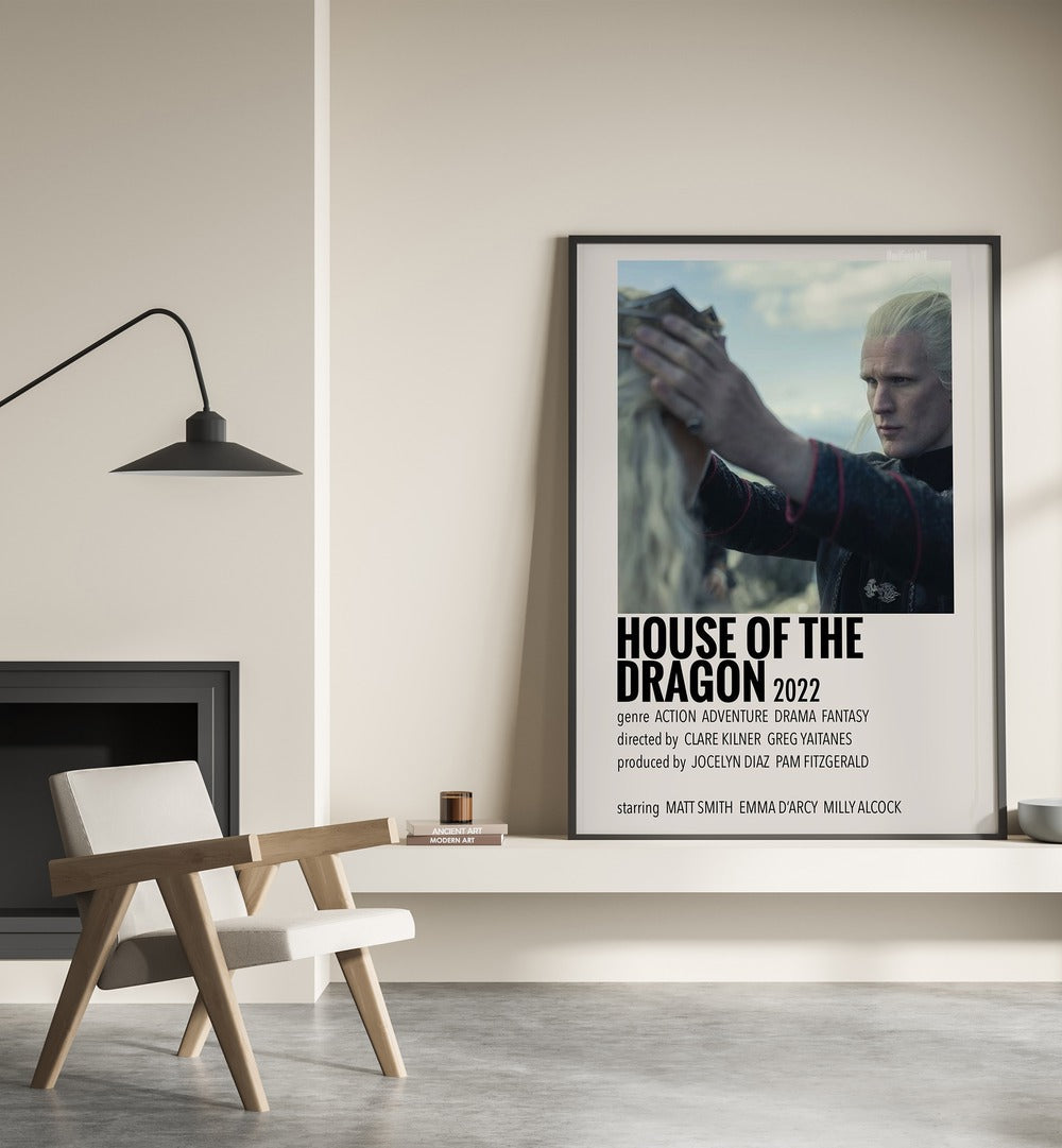 HOUSE OF THE DRAGON 2022 II MOVIE POSTERS in Black Plain Frame placed on wall beside chair and lamp