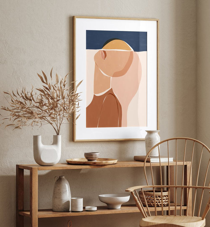 Half Face Half Sun By Ivy Green Women Illustration Paintings in Oak Wood Frame With Mount place on a beige wall above a table