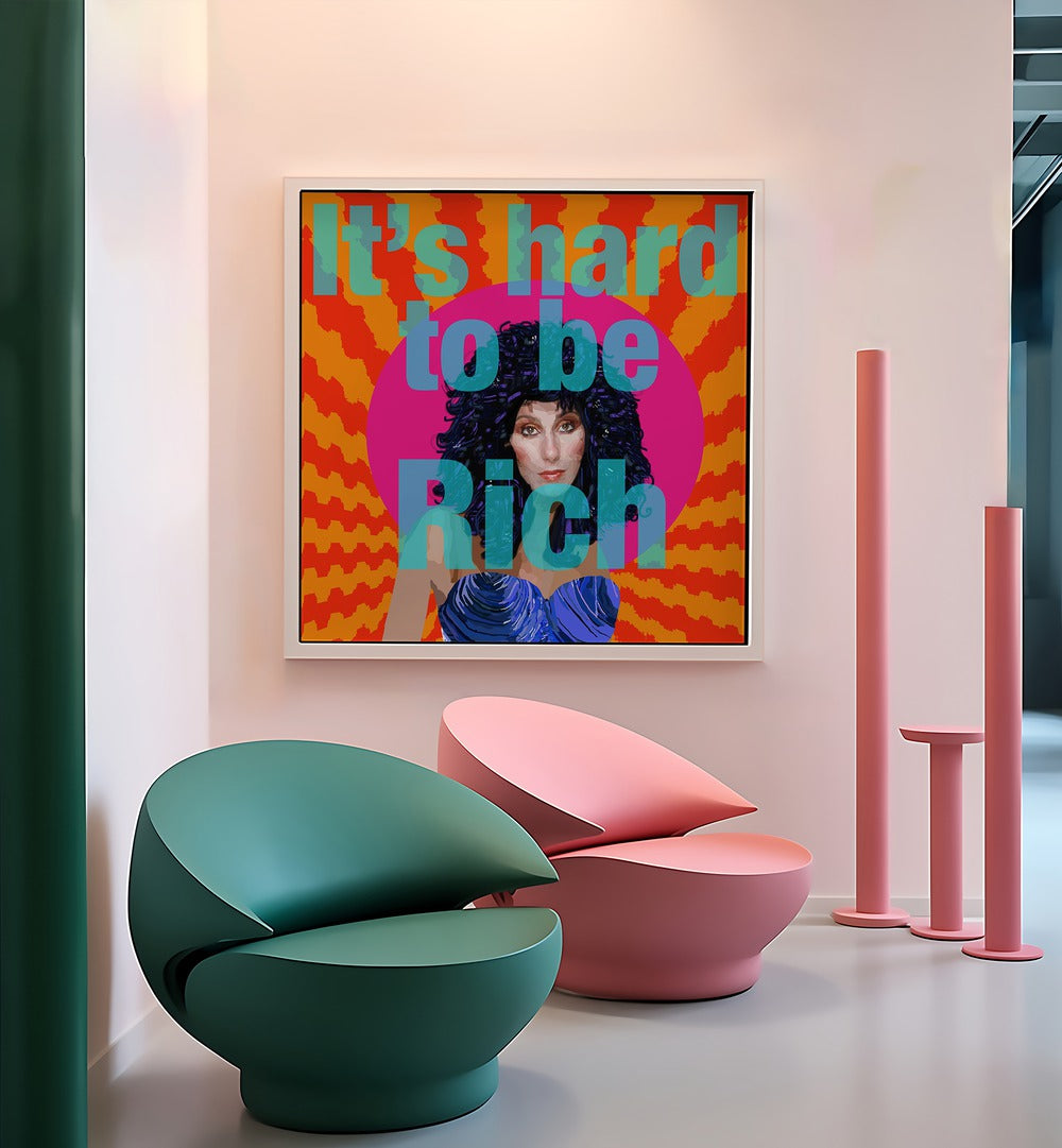 Hard to Be Rich By Lynnda Rakos Pop Art Paintings Pop Art Prints in White Plain Frame placed on a wall behind a chairs