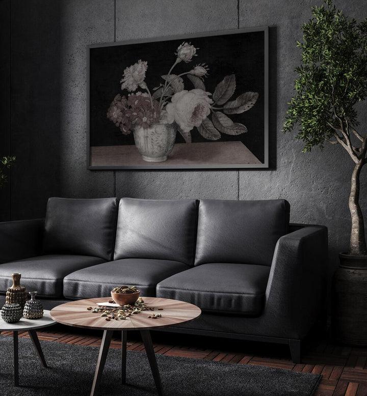 Haunted Hyacinth Holder Gothic Wall Art Prints in Black Plain Frame hanging on a wall above black leather couch beside a plant.