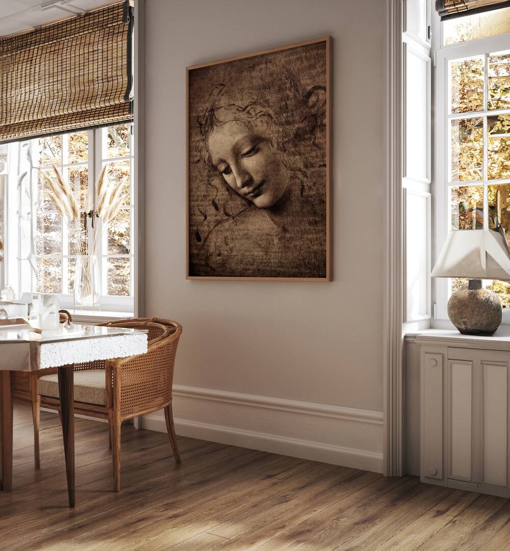 Head Of Women Vintage Paintings in Oak Wood Plain Frame placed on a wall between window behind a table