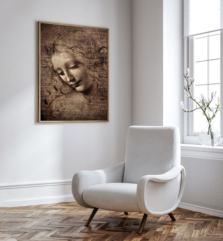 Head Of Women Vintage Paintings in Oak Wood Plain Frame placed on a wall beside a white chair and a window