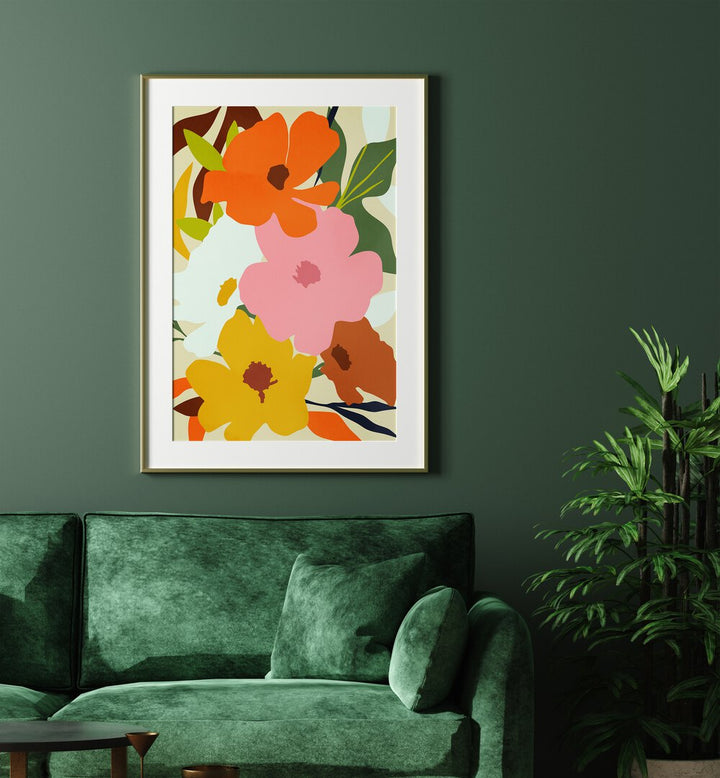 Hello Spring By Uma Gokhale Botanical Art Prints in Gold Frame With Mount on a wall behind a green sofa