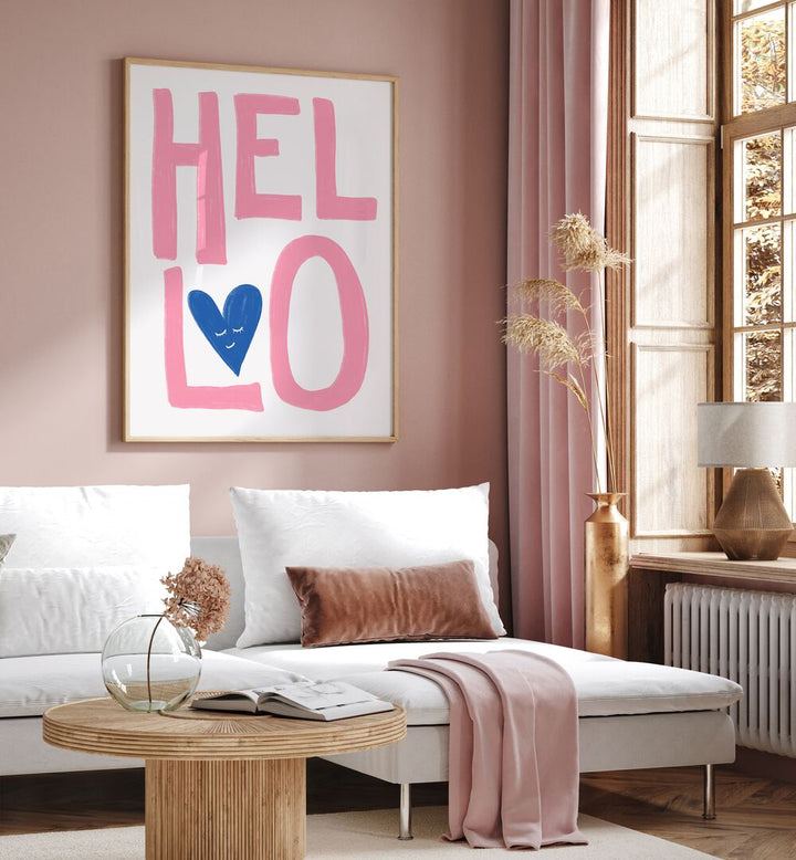 Hello by Athene Fritsch Quotes Posters Wall Art Prints in Oak Wood Plain Frame placed on a wall behind a sofa